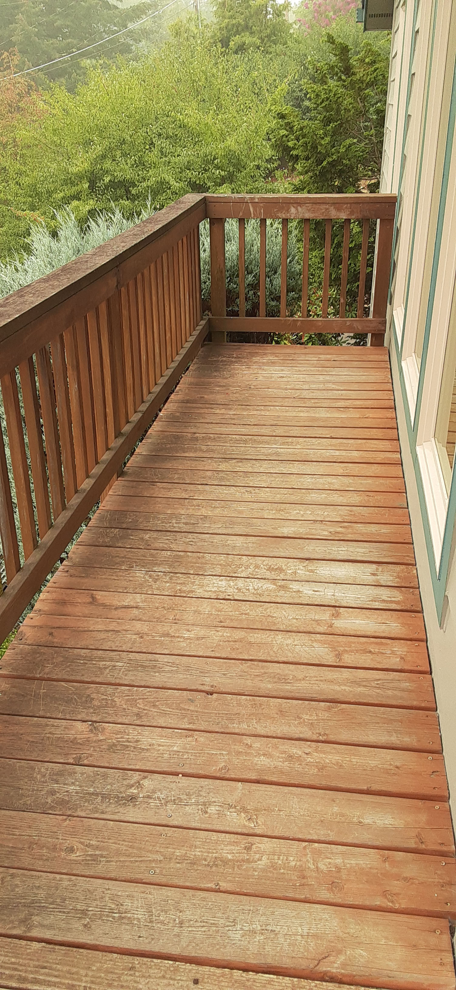 Old, scratched up wood deck in need of remodeling