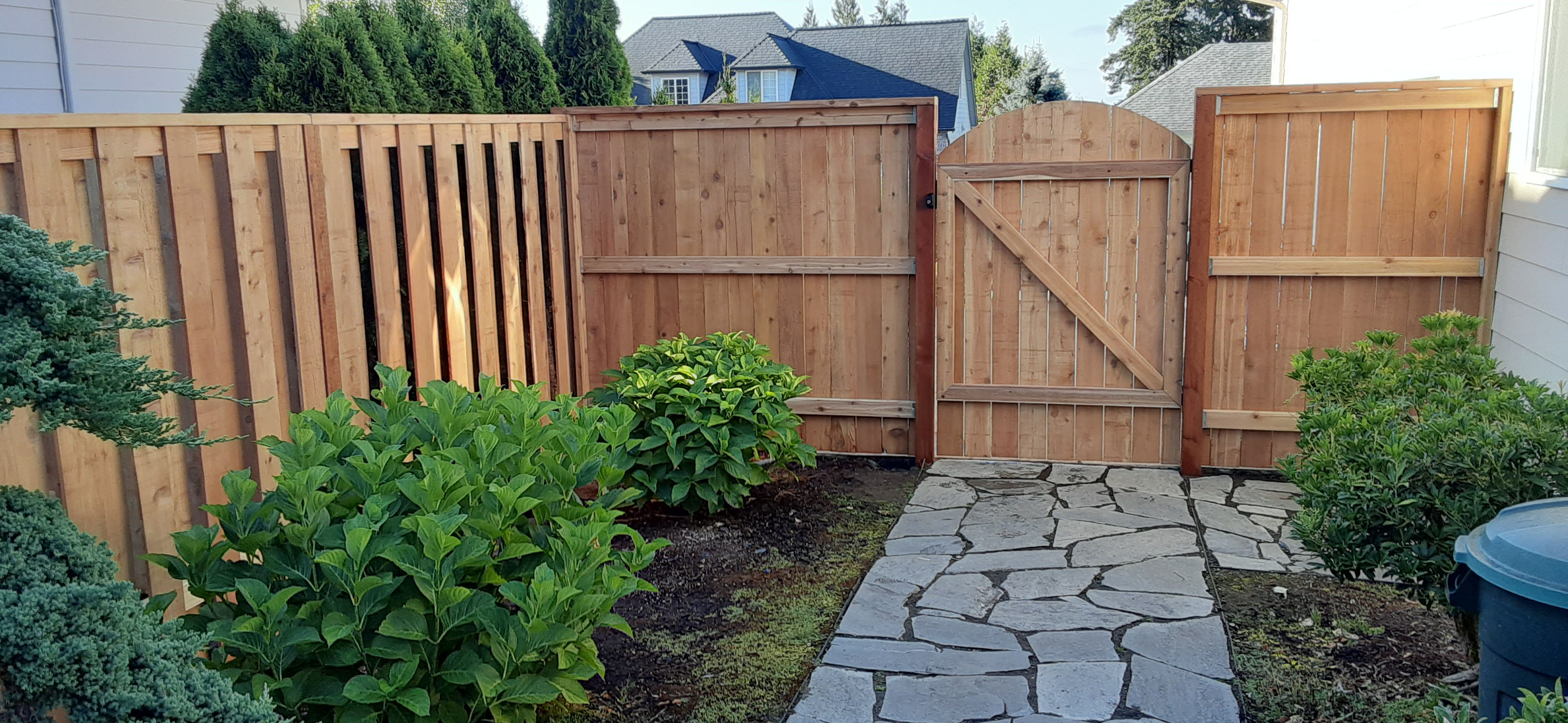 Remodeled wood fence with nicely built gate